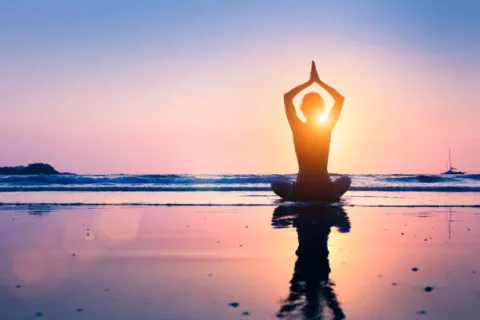 yoga pose on the beach