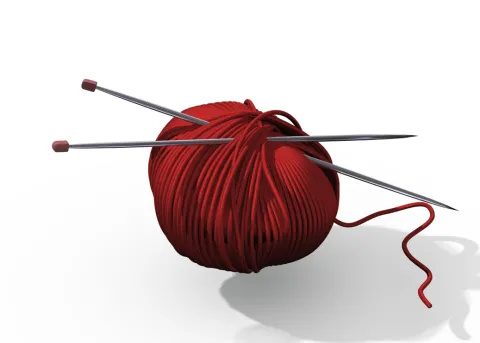 ball of yarn and needles